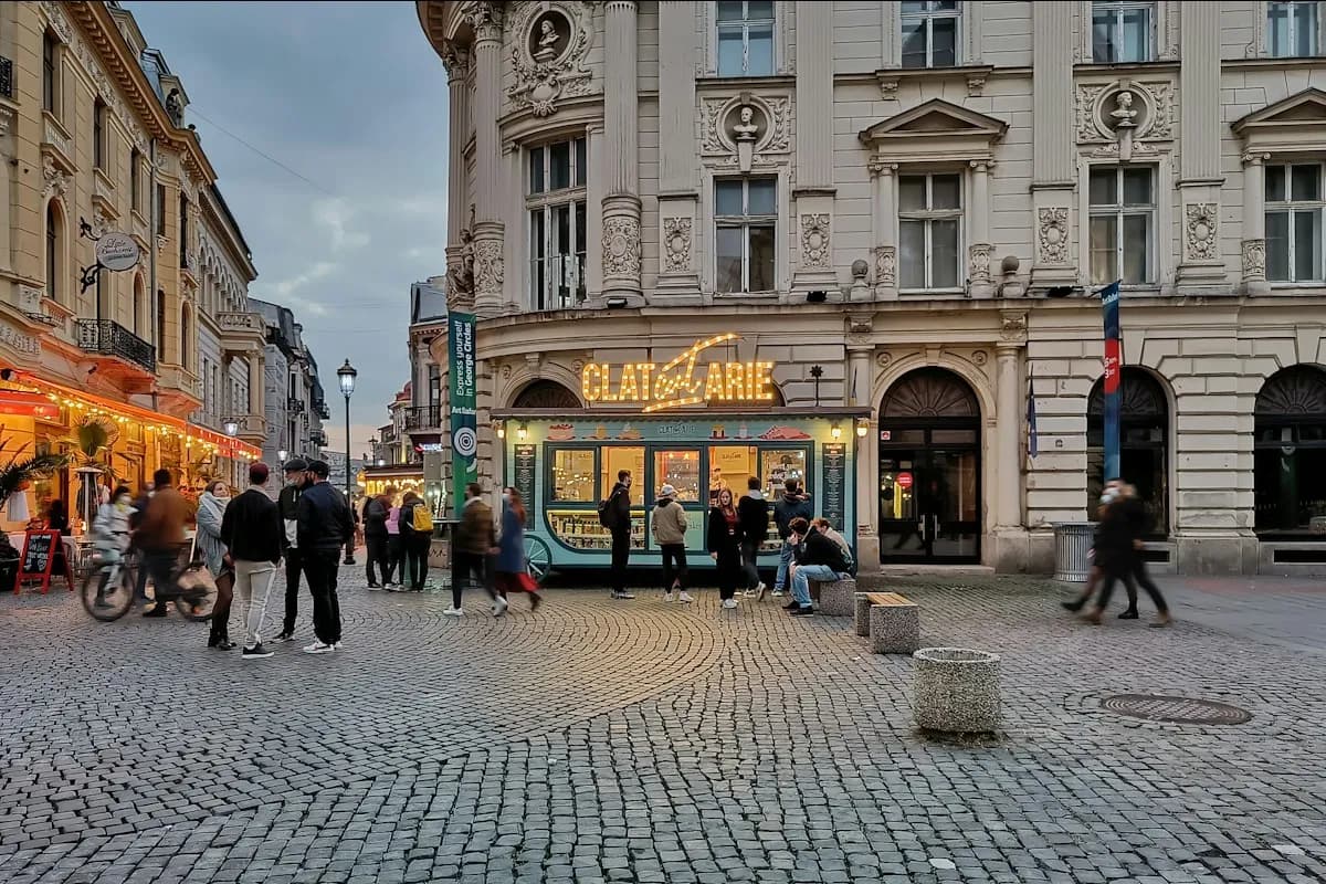 Pedestrians on a cobbled street in Bucharest’s old town