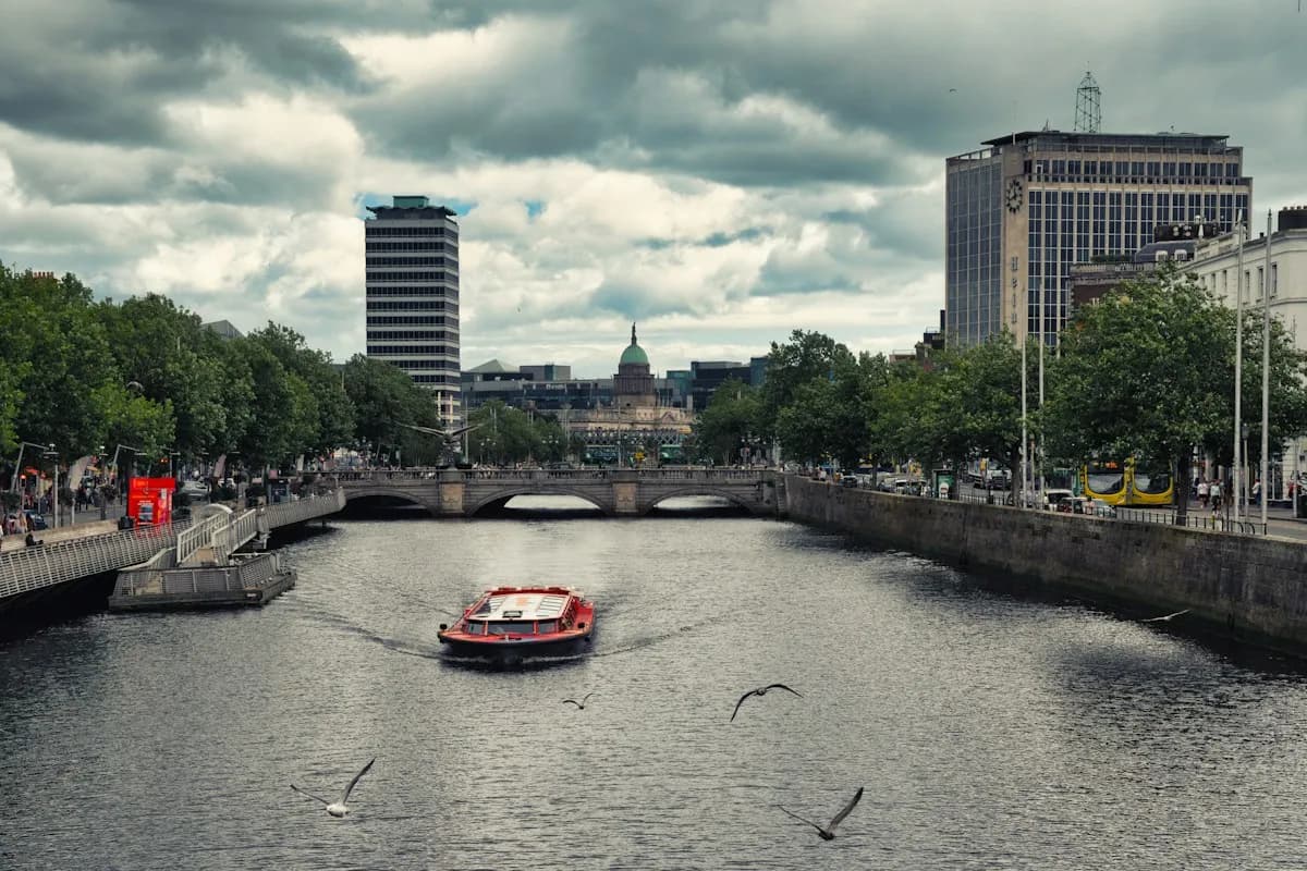 Boat on the River Liffey between central Dublin’s riverside buildings