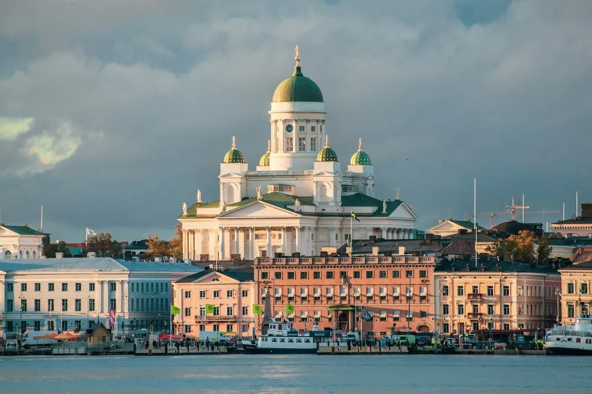 Helsinki Cathedral rising above colorful waterfront buildings