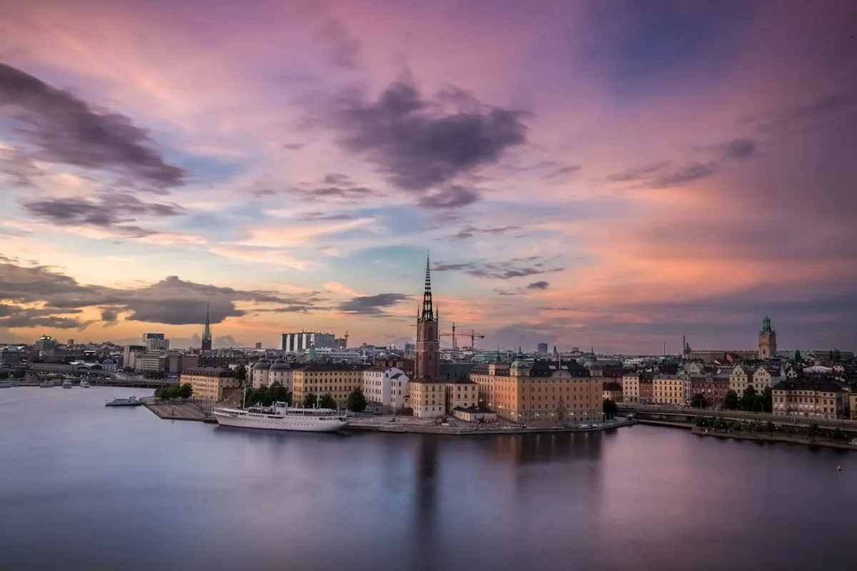 Stockholm waterfront and Riddarholmen church spire at dusk